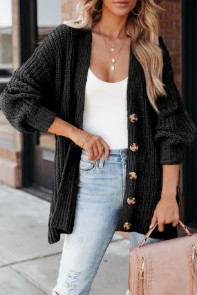 Cardigan tricoté noir boutonné sur le devant à épaules tombantes