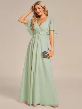 Robe de soirée élégante en mousseline de soie avec manches flottantes